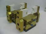 Pinza tomapiezas dual